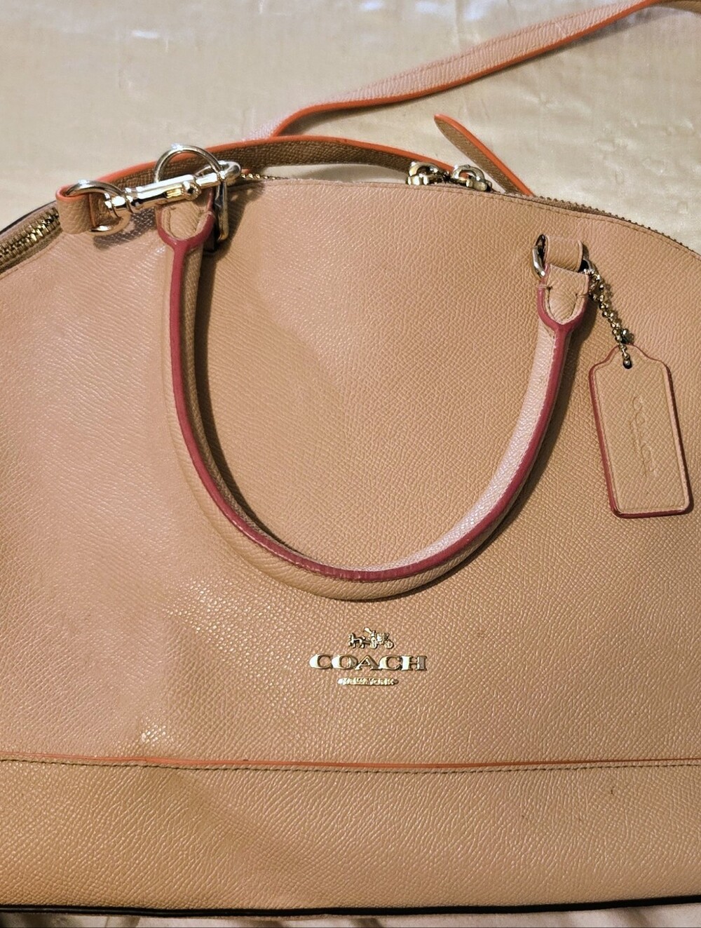 Coach Sierra Satchel featuring distinctive pink and orange accent piping